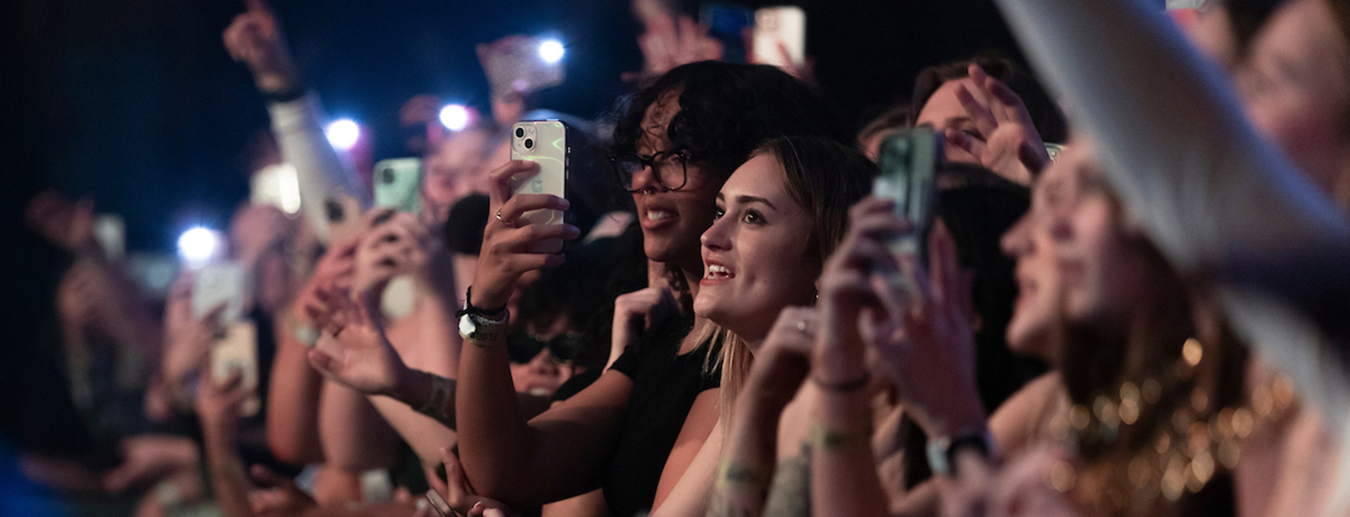 Crowd of UNO students attending a music concert at night