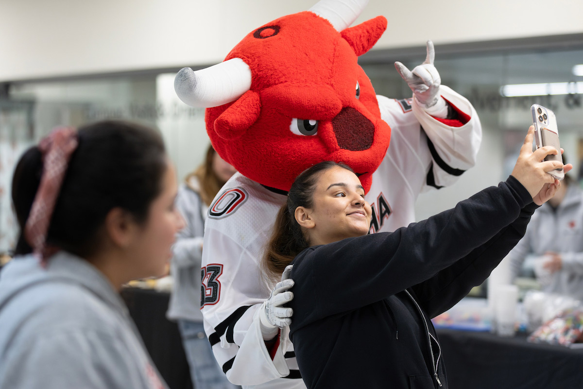 student takes a selfie with Durango on his birthday