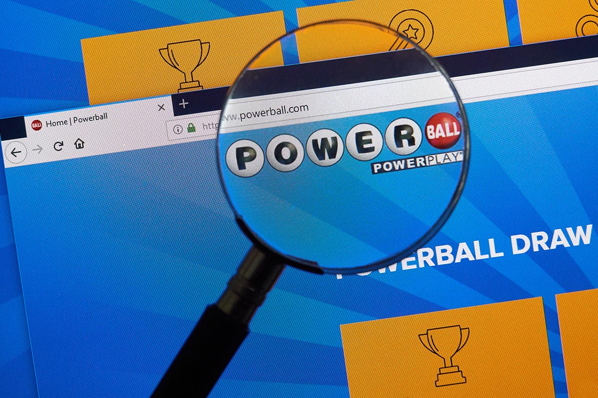 A magnifying glass looking at the Powerball website