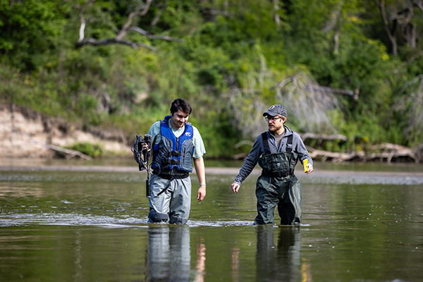 Assistant Professor David Manning, PhD, and masters student Rodrigo Meza perform a variety of tests in the Elkhorn River Research Station