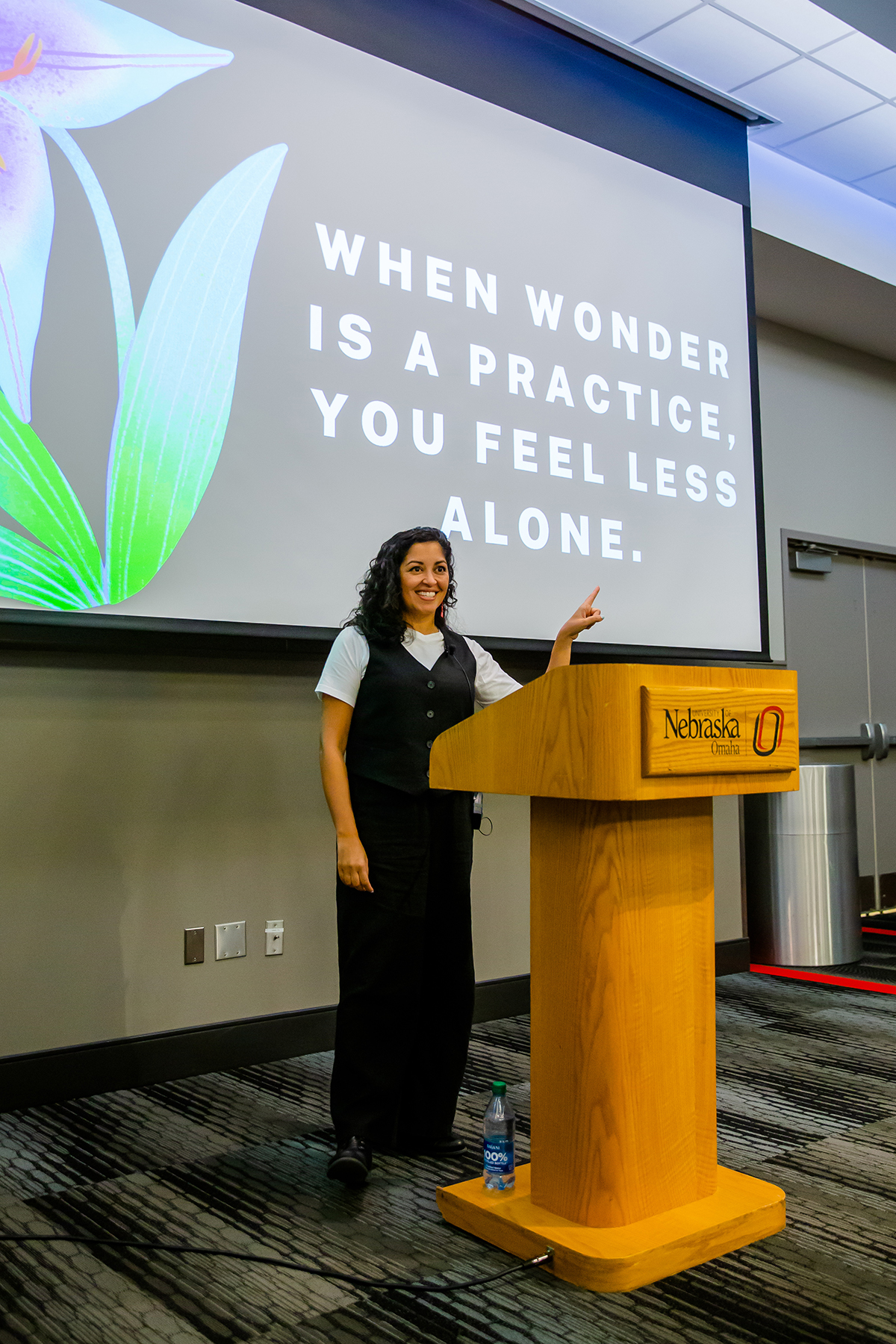 Visiting author speaking in front of a crowd