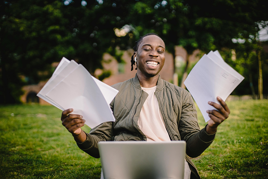 happy student with completed essay