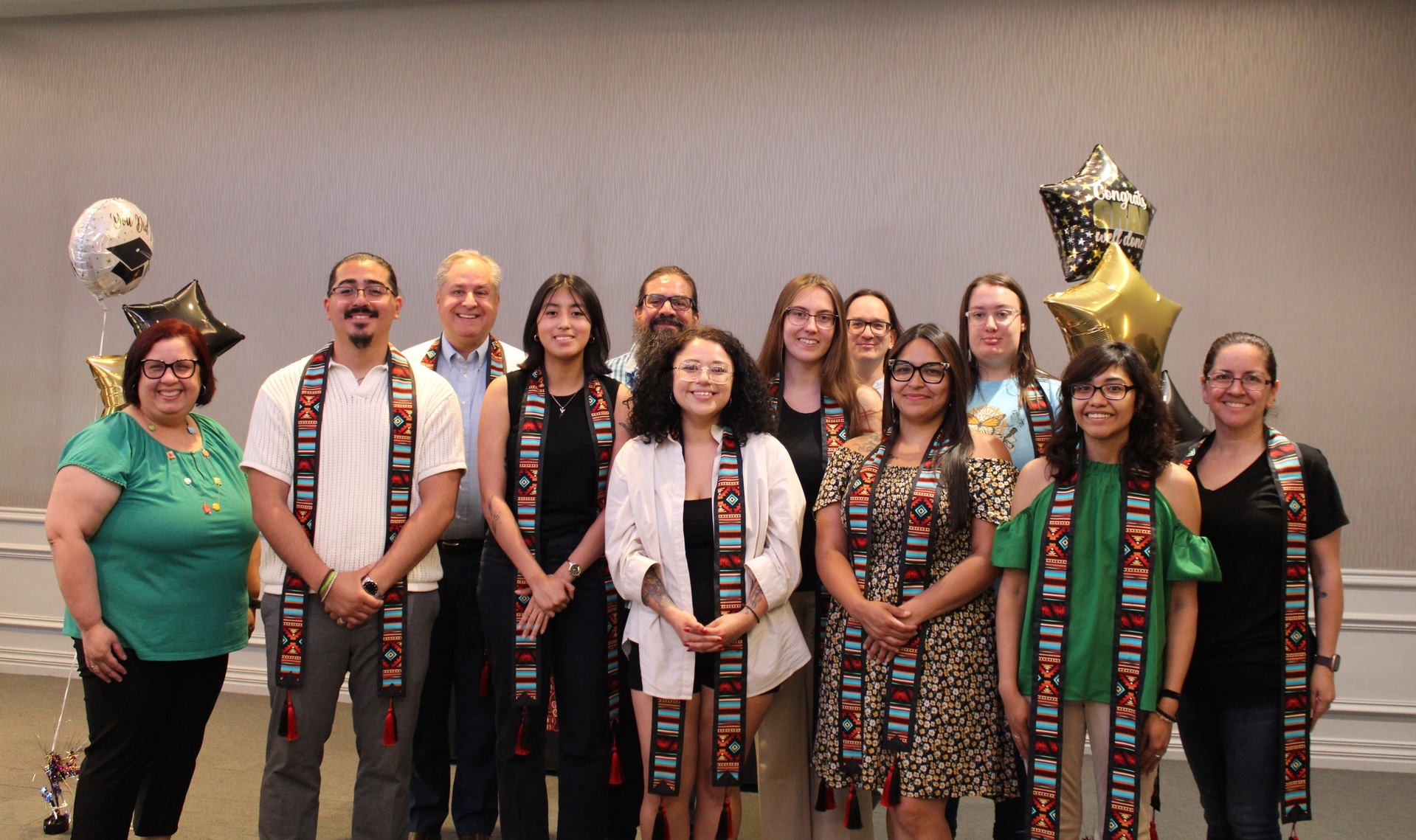 OLLAS students with their sashes along with OLLAS faculty members