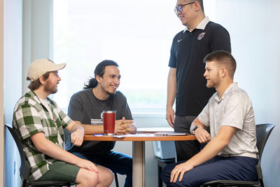 people meeting at desk