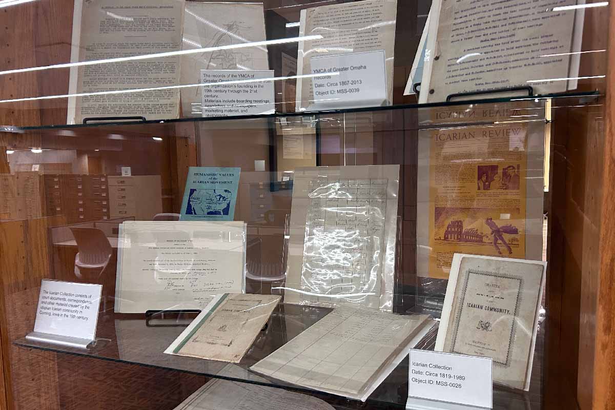 wooden shelves with papers, books, and other items surrounding research materials on the history of the American West