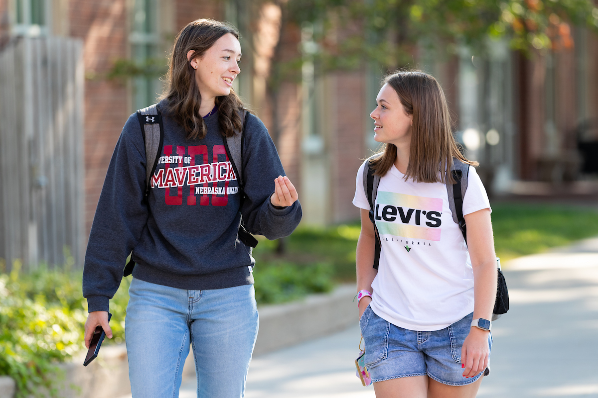 two students walk on campus