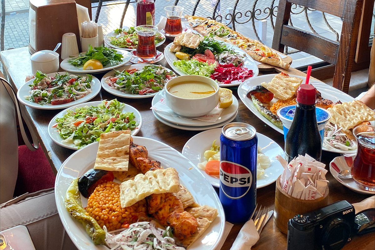 A table full of plates of Turkish food in a restaurant