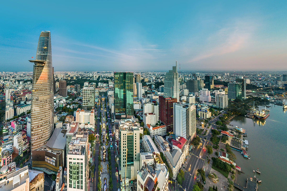 Skyline of Ho Chi Minh City, Vietnam. Buildings and water viewable.