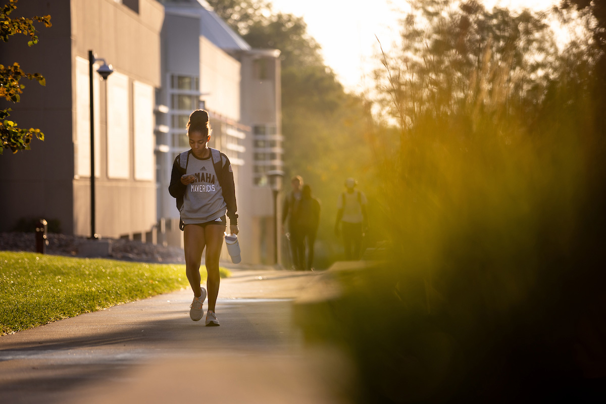 student walking on campus