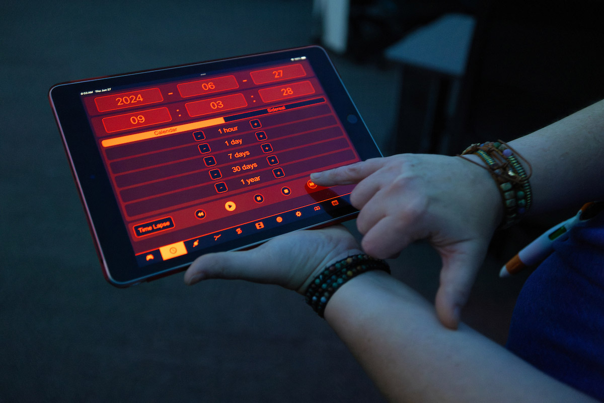 Person showing a device controlling the show