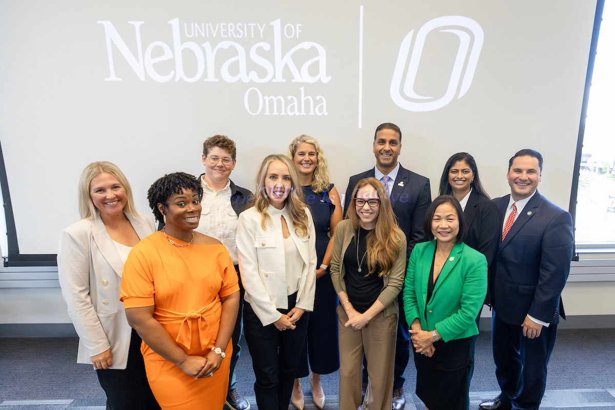 UNO Chancellor Joanne Li, Ph.D., CFA, (front row, far right) and Associate Vice Chancellor of Innovative & Learning-Centric Initiatives, Jaci Lindburg, Ph.D. (back row, far left), with the event's national and local leader panel members.