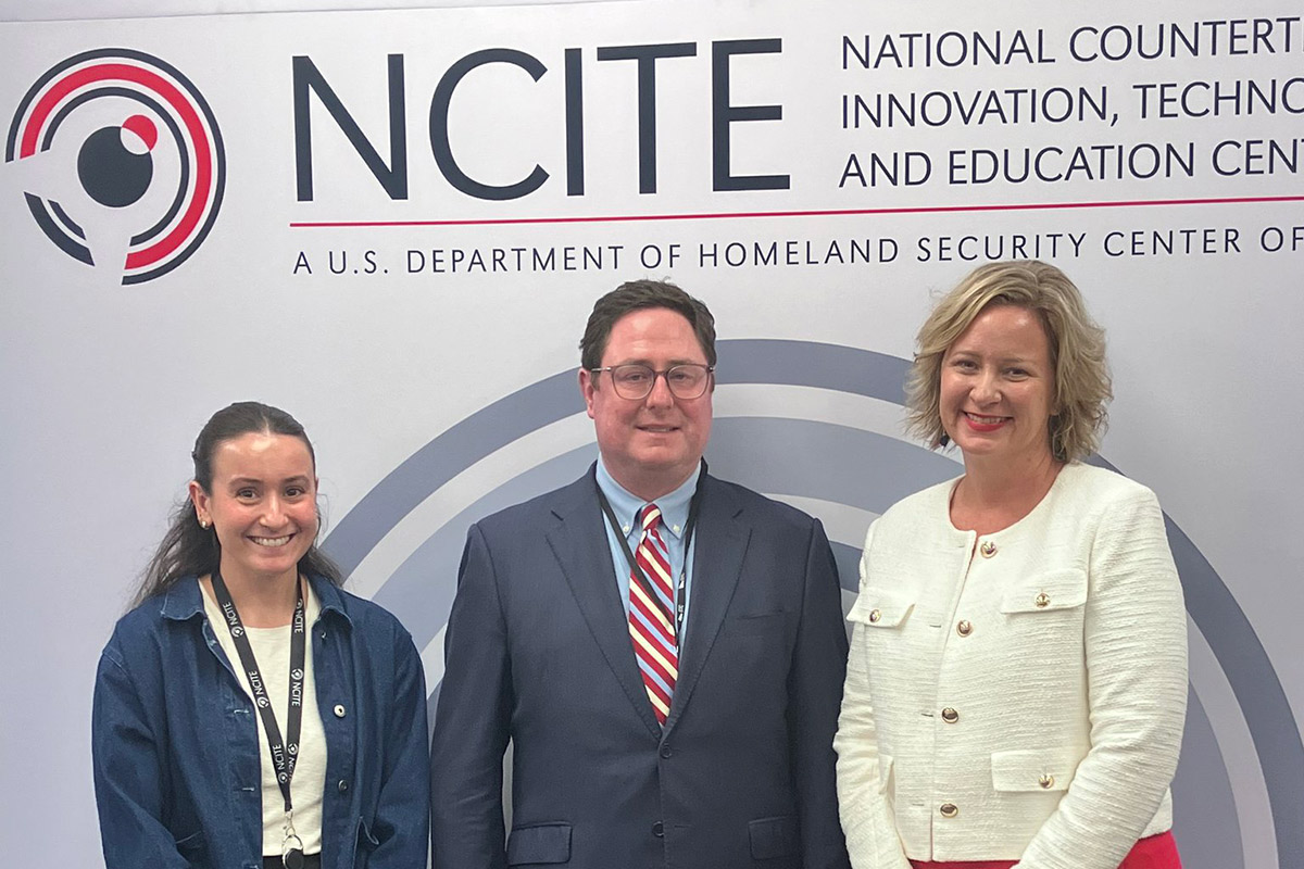 U.S. Rep. Mike Flood (center) and NCITE Director Gina Ligon (Right).