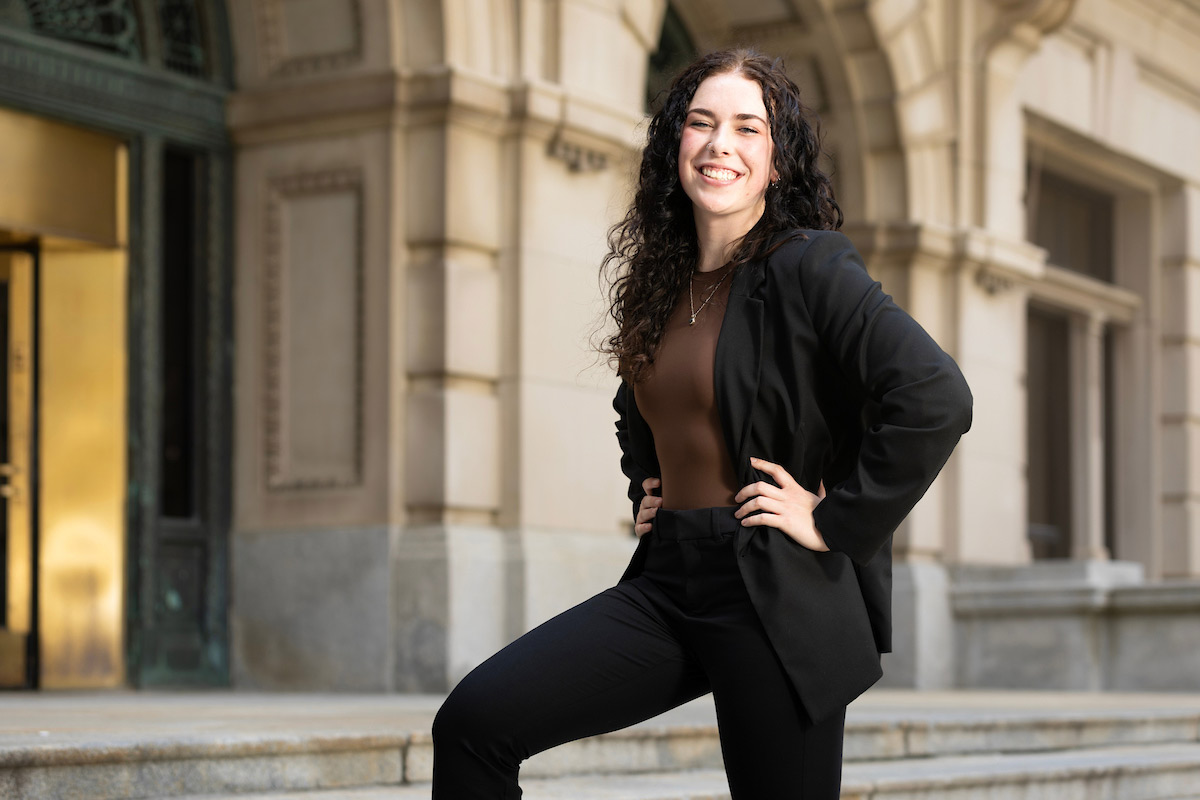 UNO student Peri Heyen poses outside of the Douglas County Courthouse where she has an internship with the clerk's office 