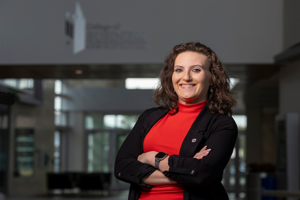 UNO alumna Sandy Ojer Viejo, originally from Spain, stands in the College of Business Administration at UNO, where she found a welcoming community and pursued her degree in international business and marketing.