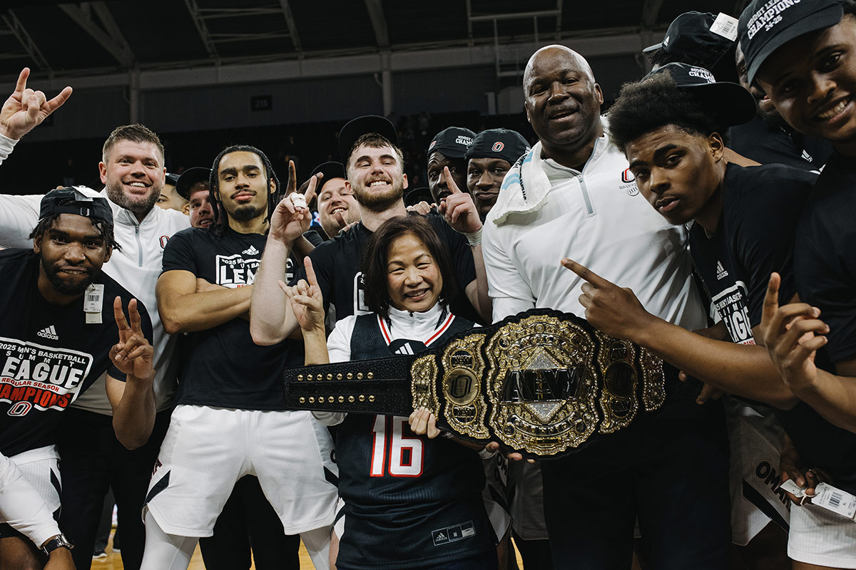 UNO Chancellor Joanne Li, Ph.D., CFA, celebrating with the team.