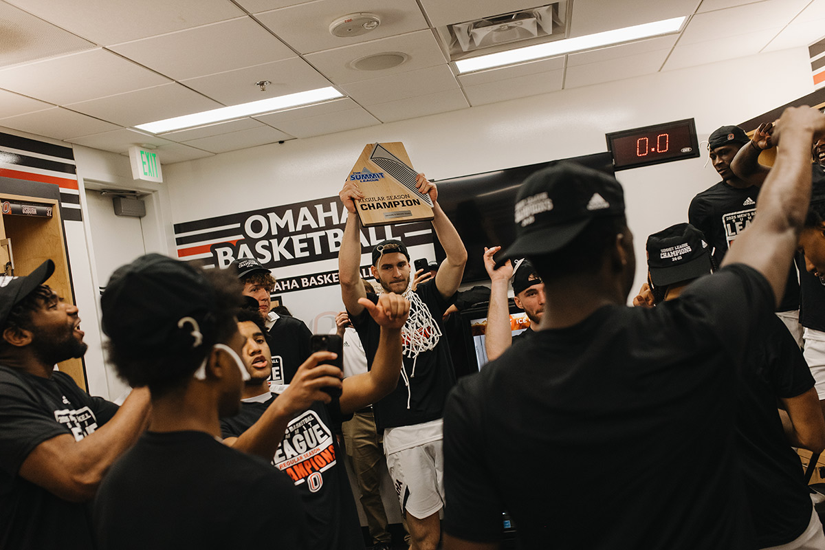 The newly crowned champions celebrate in the locker room after the game.