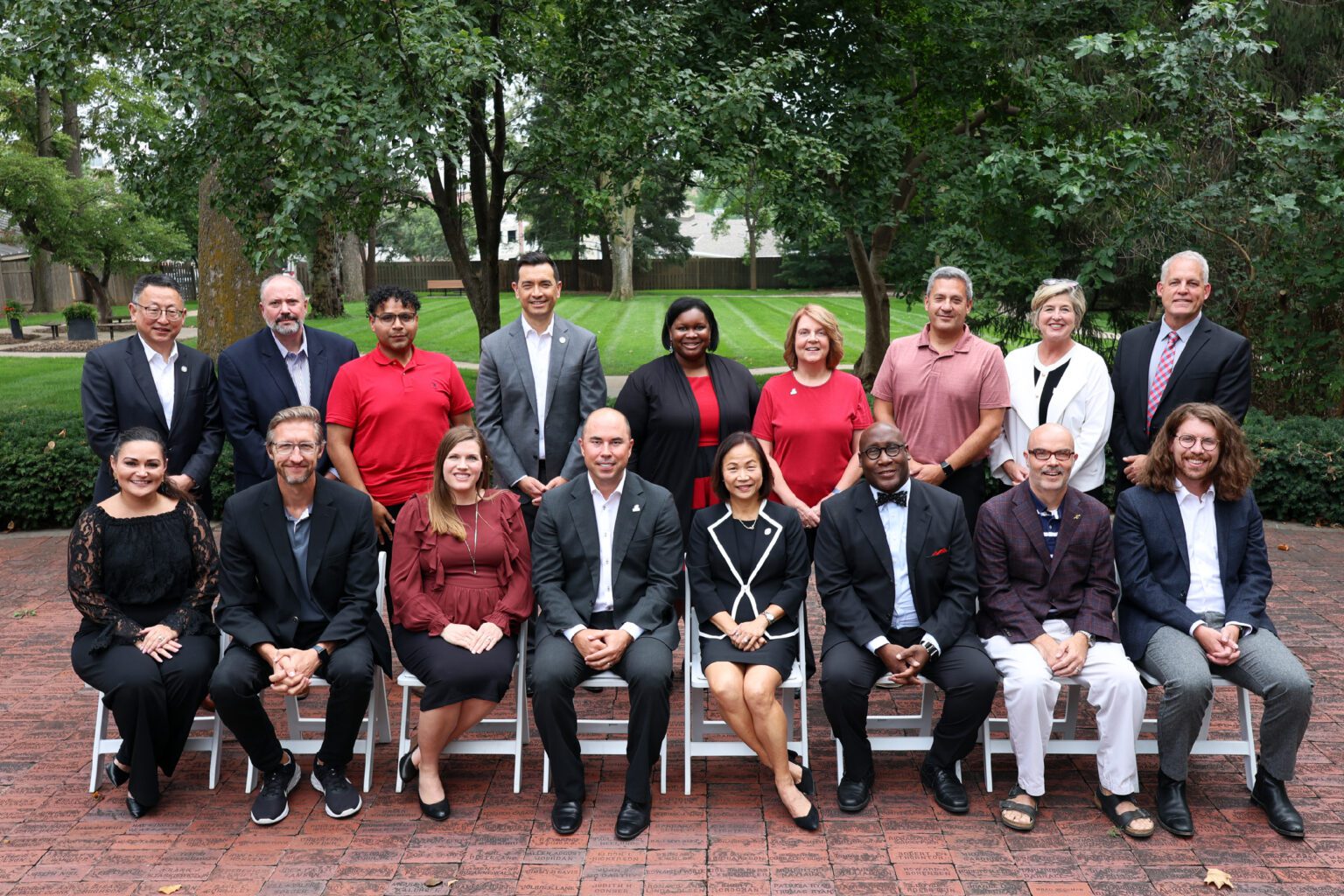 Photo of the UNO Alumni Association Board of Directors, outside the Thompson Alumni Center on UNO's campus.