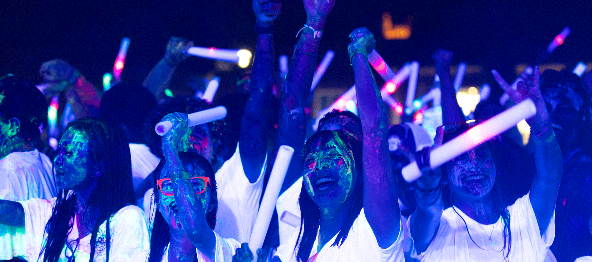 University of Nebraska at Omaha students attend Glo at UNO in the Pep Bowl