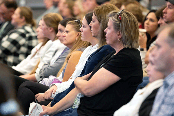 parents listen to a speaker at orientation