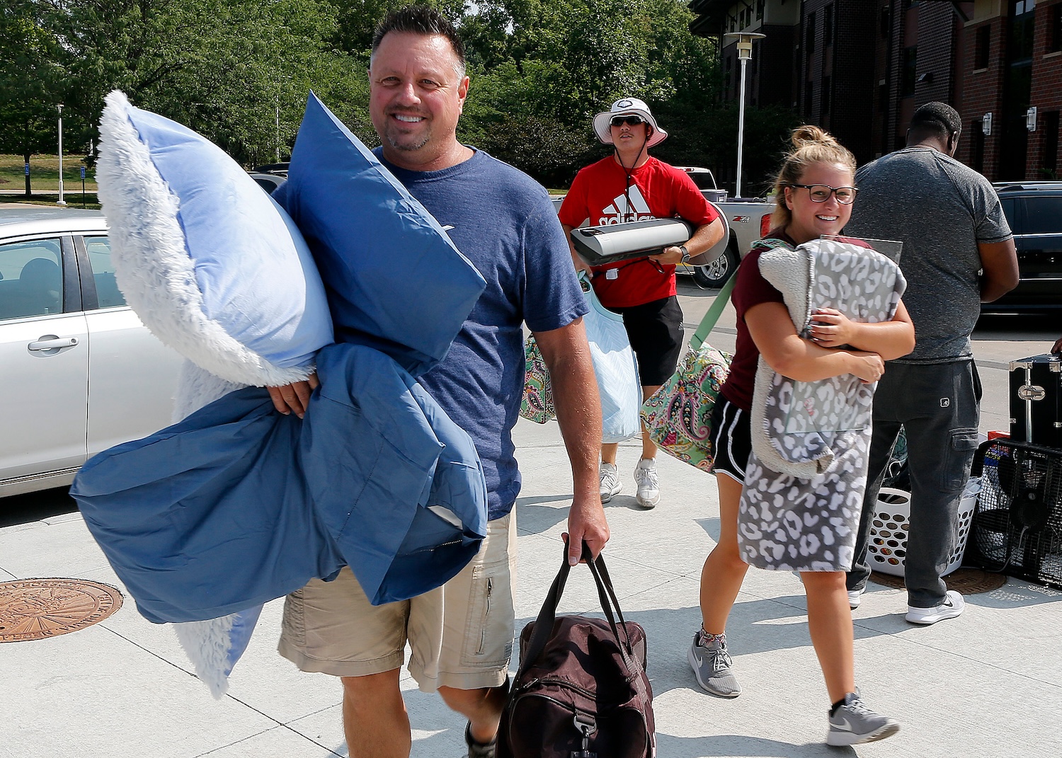 Parent and student moving into dorms.