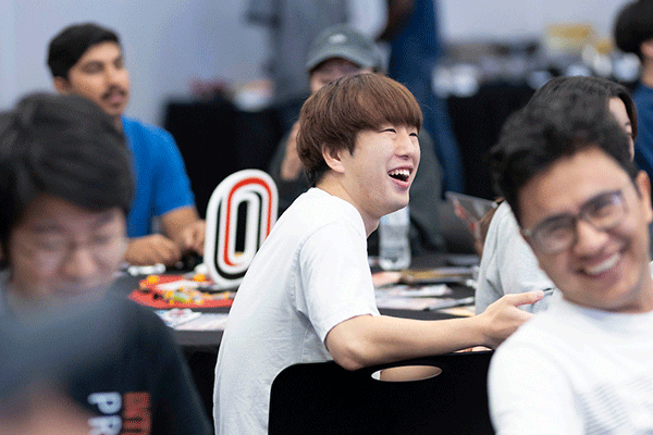 uno international students smile at a presentation