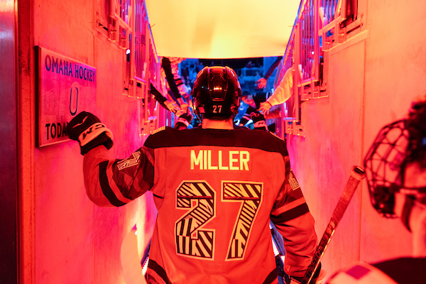 Hockey player walking out on the ice arena